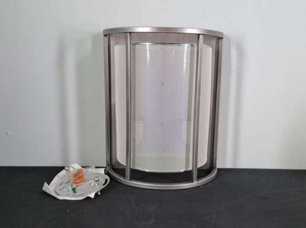 Front view of a brushed nickel cage-style wall sconce with diffuser and included mounting plate and hardware on table.